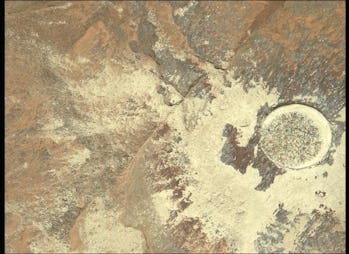 The Perseverance rover captured this view of a rock after it had scraped off its top layer.