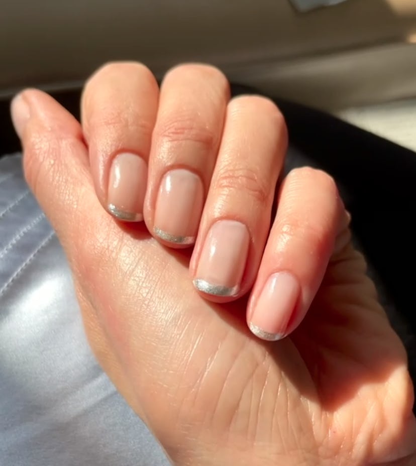 Silver French tip nails on Gemma Chan