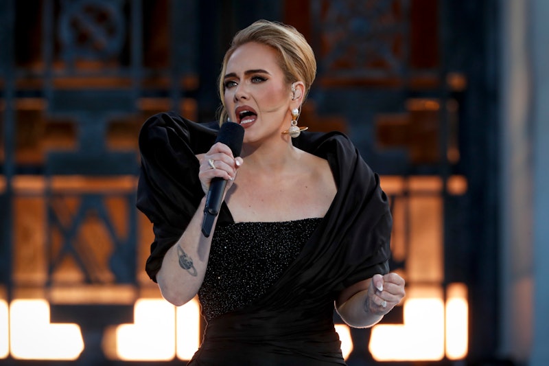 Adele showed off her Saturn earrings and tattoo during her 'One Night Only' concert.