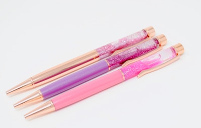 Three pens in shades of pink and purple with glitter