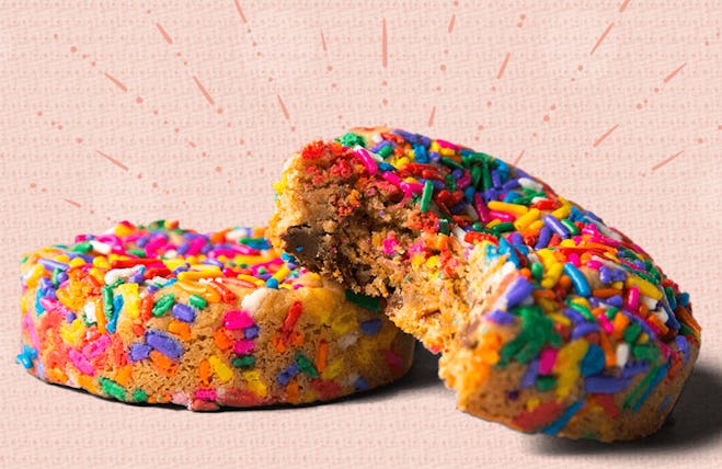 Image of two thick, round cookies topped with multicolored sprinkles.