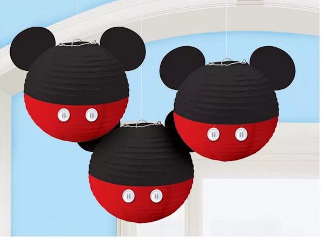 Image of three hanging Mickey Mouse-head shaped paper lanterns.