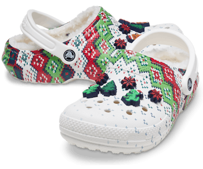 Crocs' Lined Holiday Charm Clogs in white, red, and green with festive Jibbitz.