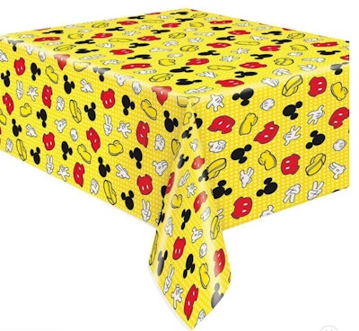 Image of a yellow table cover with Mickey Mouse print.