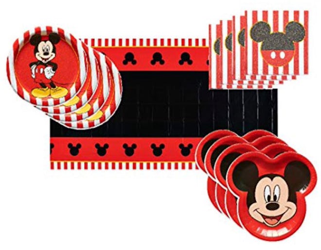 Image of Mickey Mouse-themed party decorations, including Mickey Mouse plates, table cover and napki...