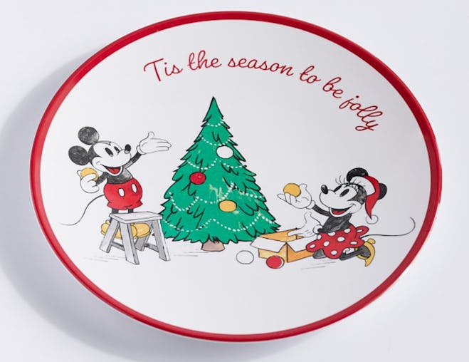 Image of a small plate with Christmas tree-themed Mickey Mouse and Minnie Mouse print. 