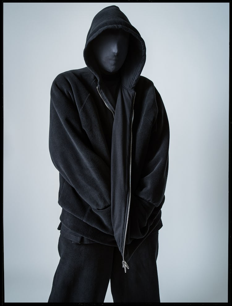 Seth Bedzo in a dark balenciaga couture hoodie