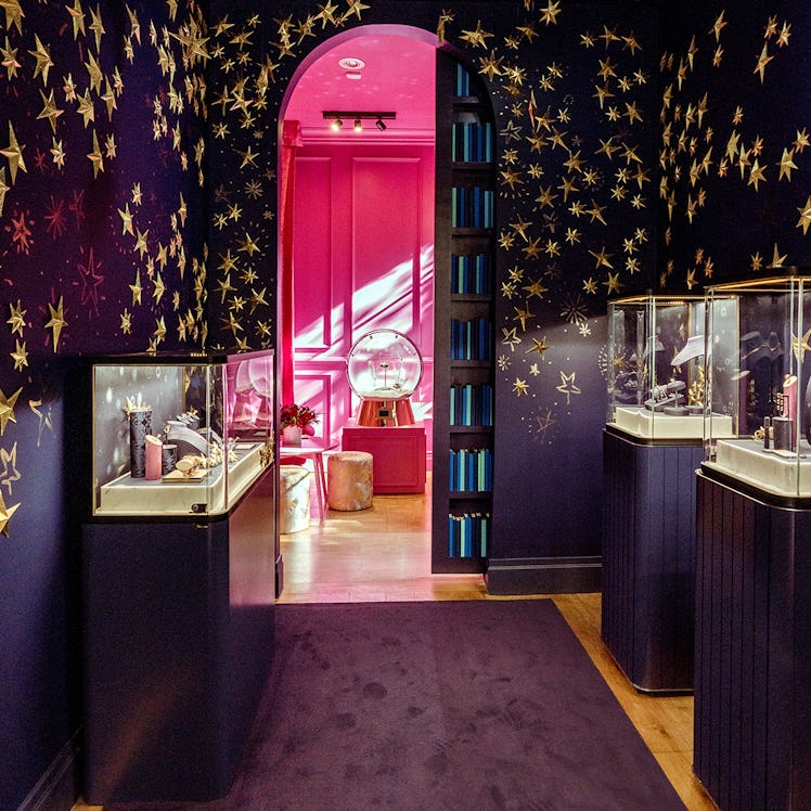 Purple hallway with jewelry displayed inside the Tiffany & Co. corner store