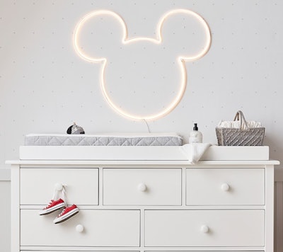 Image of a hanging neon light in the shape of a Mickey Mouse head.