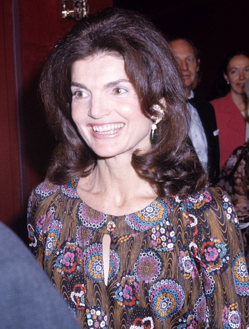 A roundup of Jackie Kennedy Onassis' beauty looks that showcased the former First Lady's timeless st...