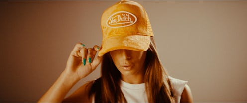 A model wearing a Von Dutch trucker hat