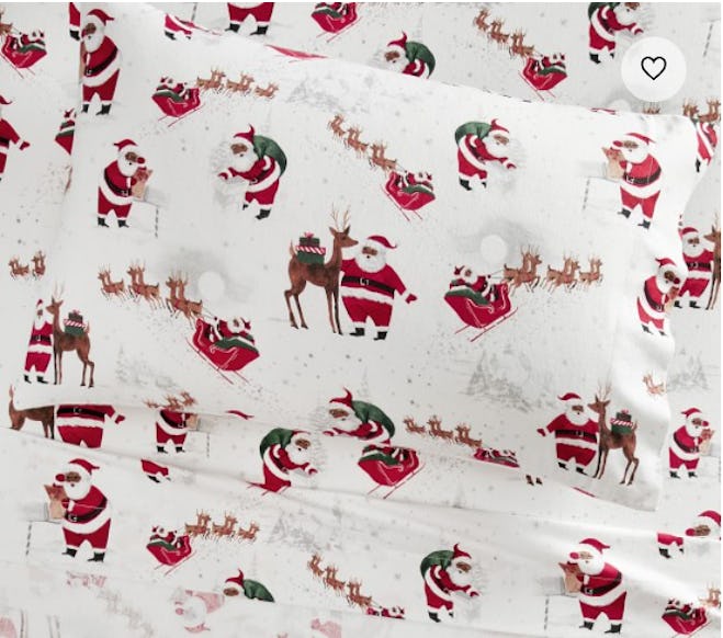 Image of twin bed sheets with Santa print.