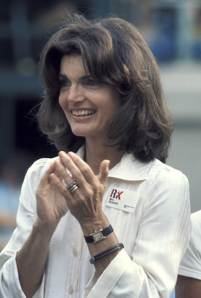 Jackie Kennedy's curtain bangs were on display at an event in the mid-70s.
