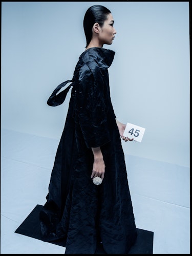 A model wearing a black Balenciaga Demna Gvasalia outfit