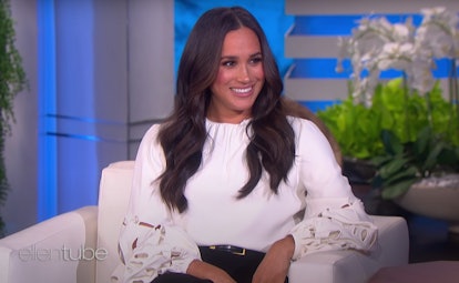 Meghan Markle wearing a white coutout sleeve blouse on the 'The Ellen Degeneres Show.'