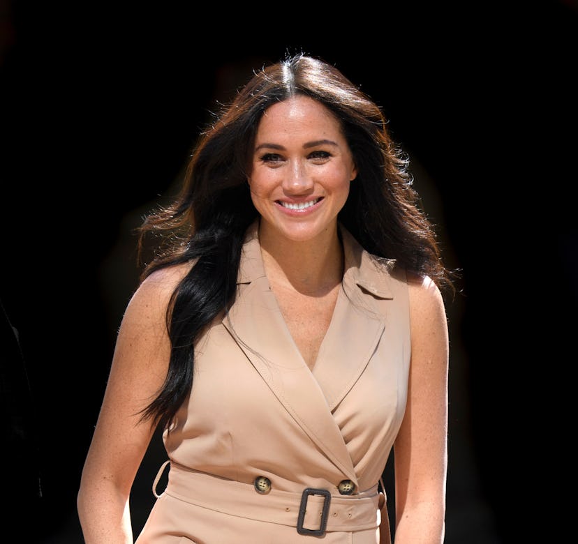  Meghan Markle in a tan trench coat dress at the University of Johannesburg.