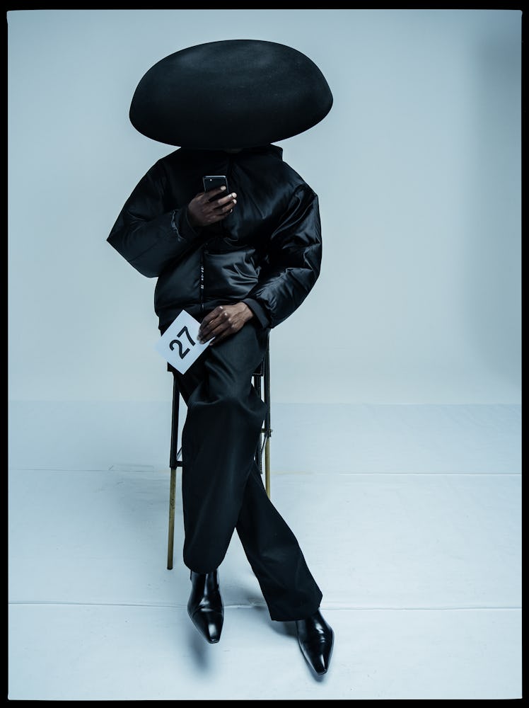 Emmanuel Adjaye wearing a black demna gvasalia balenciaga outfit