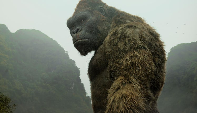 King Kong standing in between two mountains in Kong: Skull Island