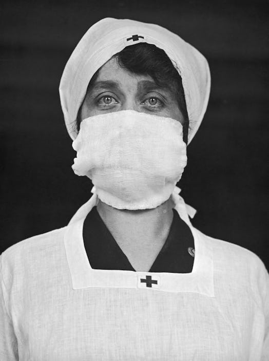 Red Cross woman wearing a face mask