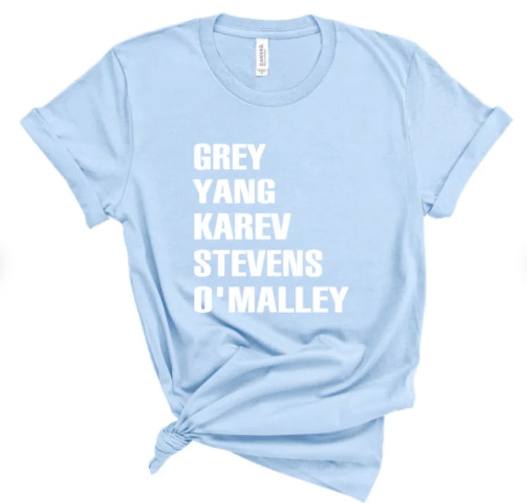 a blue shirt that says the names of the original interns from 'Grey's Anatomy'