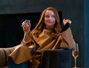 Julia Garner with a glass of wine
