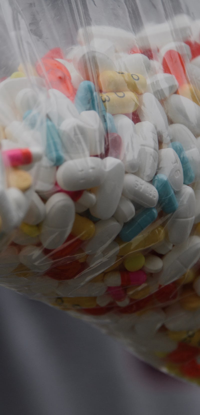 A bag of assorted pills and prescription drugs dropped off for disposal is displayed during the Drug...