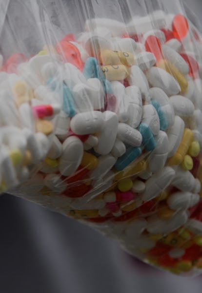 A bag of assorted pills and prescription drugs dropped off for disposal is displayed during the Drug...