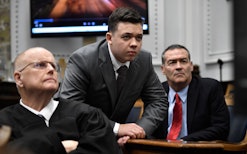 Judge Bruce Schroeder, left, Kyle Rittenhouse, center, along with his attorney Mark Richards watch a...