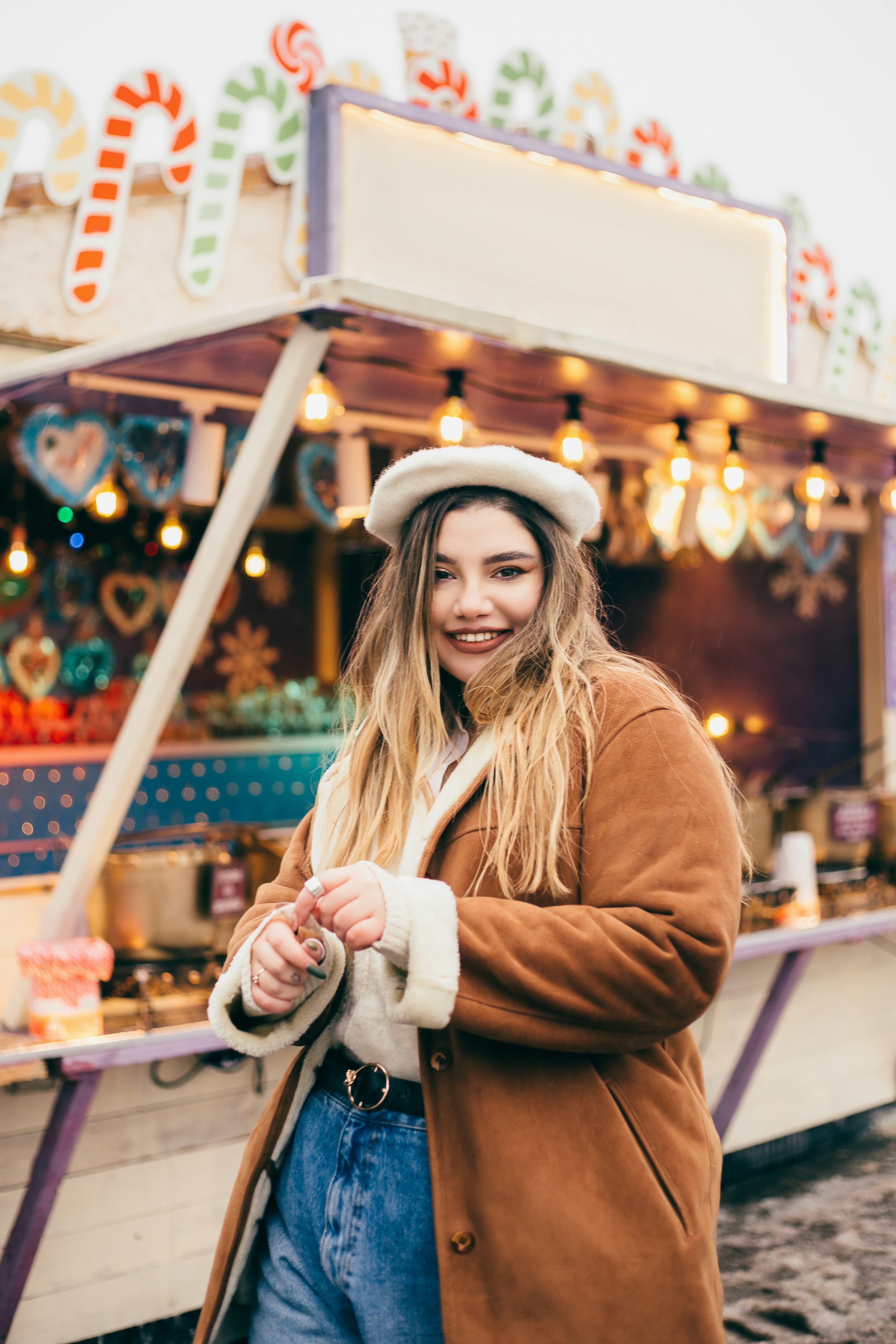Young woman at Christmas market on December 29, 2021, the best day of the month for every zodiac sig...