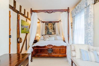 The bedroom in the 'Harry Potter' Airbnb is cozy and located in the Godric's Hollow filming location...