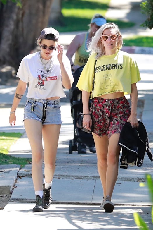 Kristen Stewart and Dylan Meyer wearing T-shirts and shorts. 