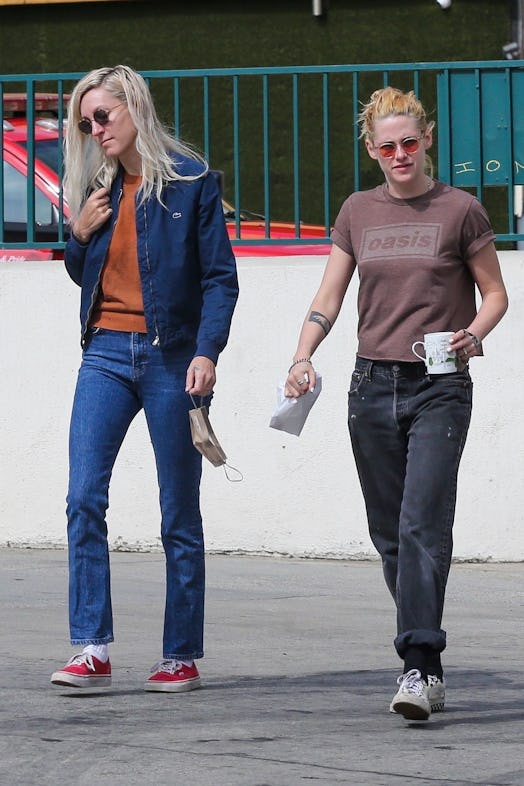 Kristen Stewart and Dylan Meyer wearing jeans. 