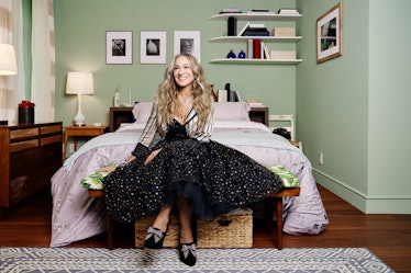 Sarah Jessica Parker sits on Carrie's bed, which inspired the 'Sex and the City' Airbnb with access ...