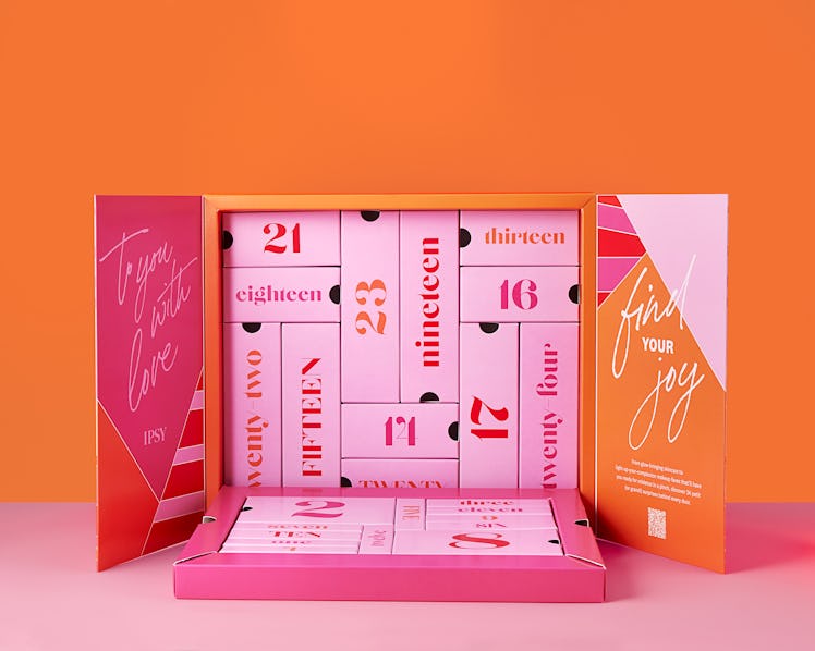 IPSY's All is Bright Advent Calendar with all 24 beauty products on display.