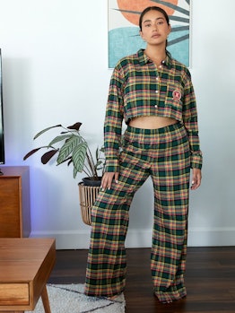 Models wearing a flannel pajama set from Savage x Fenty.