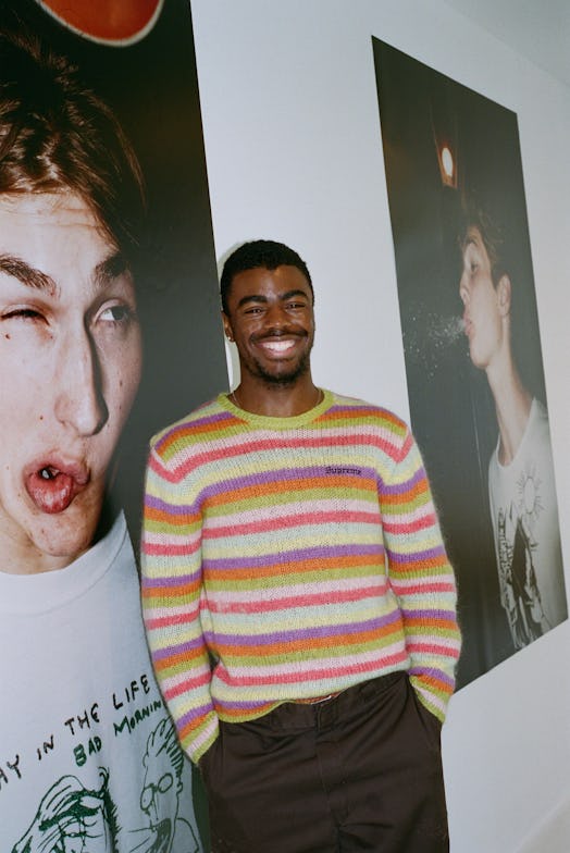 Tyrell Hampton posing leaned against the wall