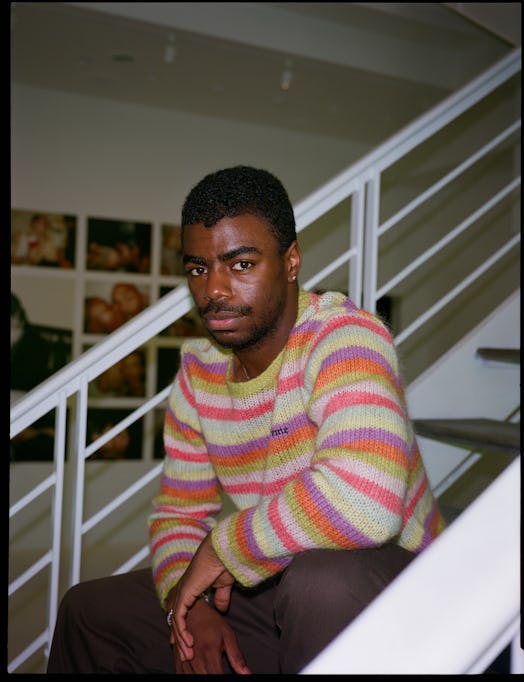 Tyrell Hampton sitting on stairs