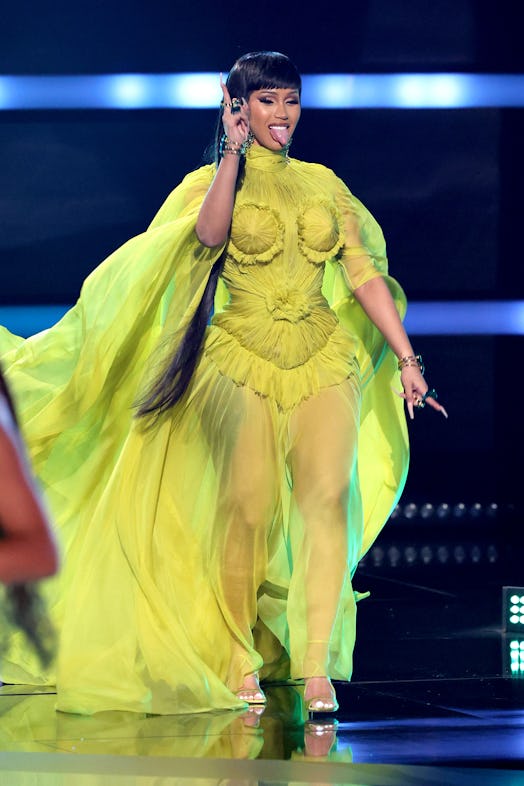 Host Cardi B speaks onstage during the 2021 American Music Awards