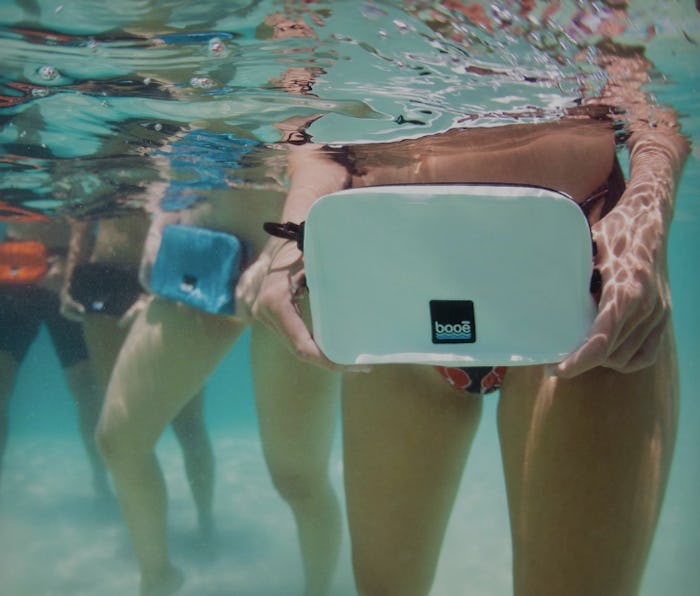 An underwater closeup of the Booe Belt Bag worn