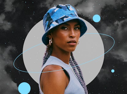 Young woman wearing a blue hat before reading her December 2021 monthly horoscope.