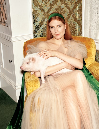 florence welch holding a baby pig