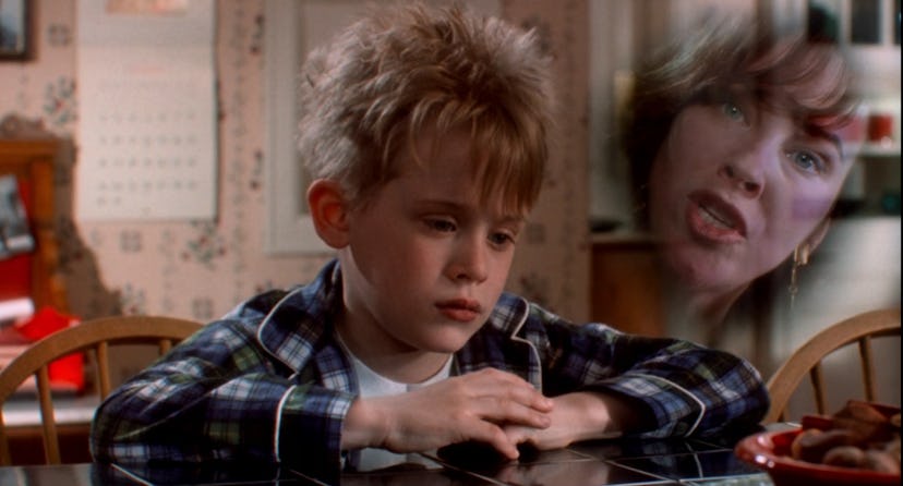 Kevin sits pensively as a vision of his mother floats beside his head in 'Home Alone'