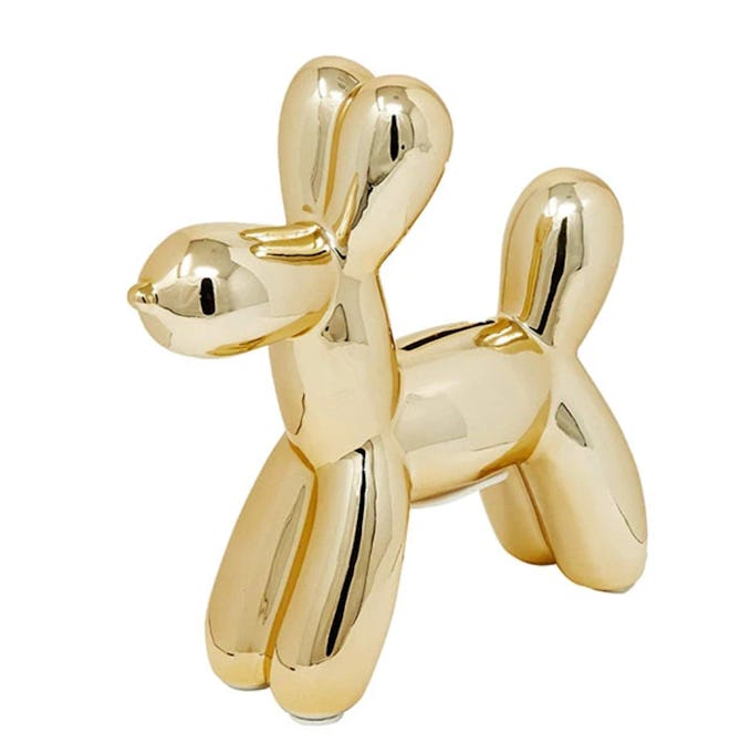 A gold bank that looks like a balloon dog