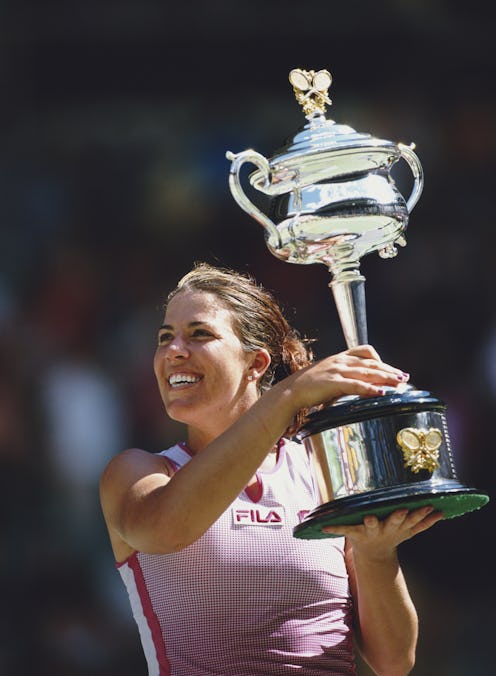 Jennifer Capriati of the United States lifts the trophy after winning the Women's Singles title agai...