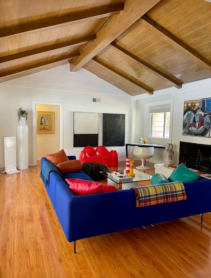 Chelsea Hansford's Los Angeles Home living room with a blue couch and colorful details