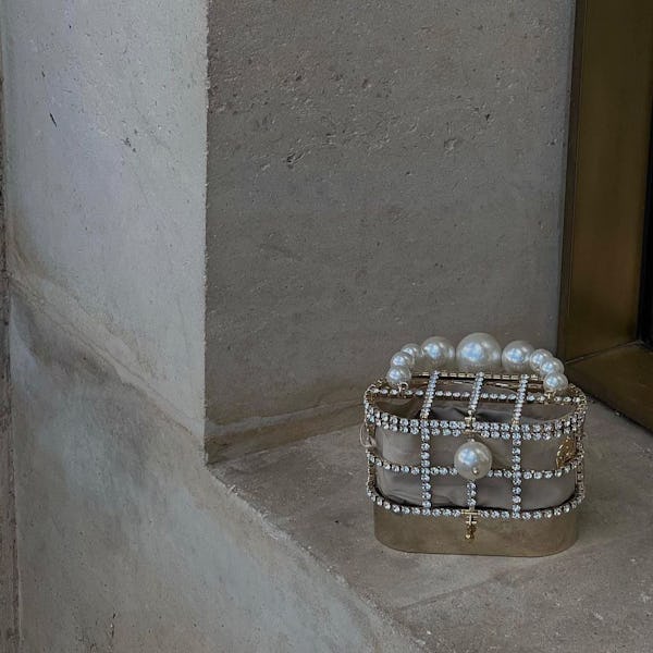 A pearl and crystal embellished handbag.