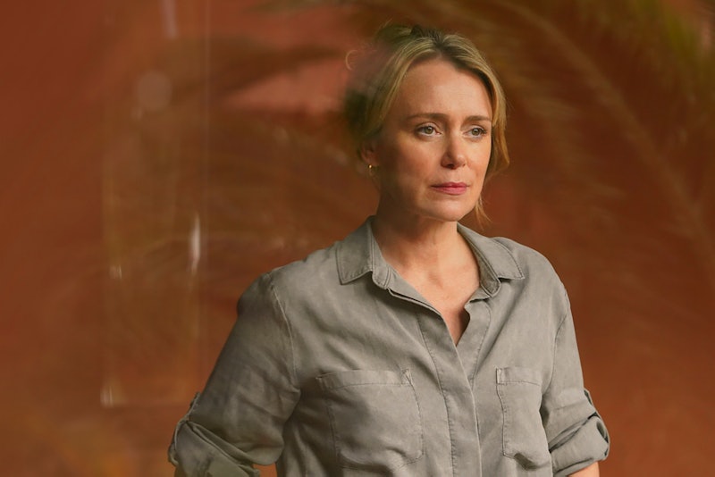 Crossfire's Jo played by KEELEY HAWES pictured wearing a khaki/grey shirt and staring out from behin...