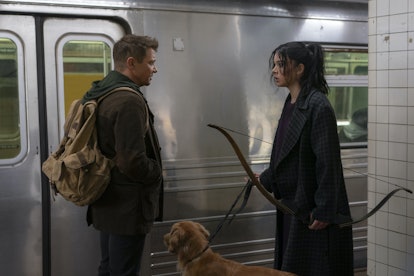 Jeremy Renner as Clint Barton and Hailee Steinfeld as Kate Bishop talking in at a subway station in ...