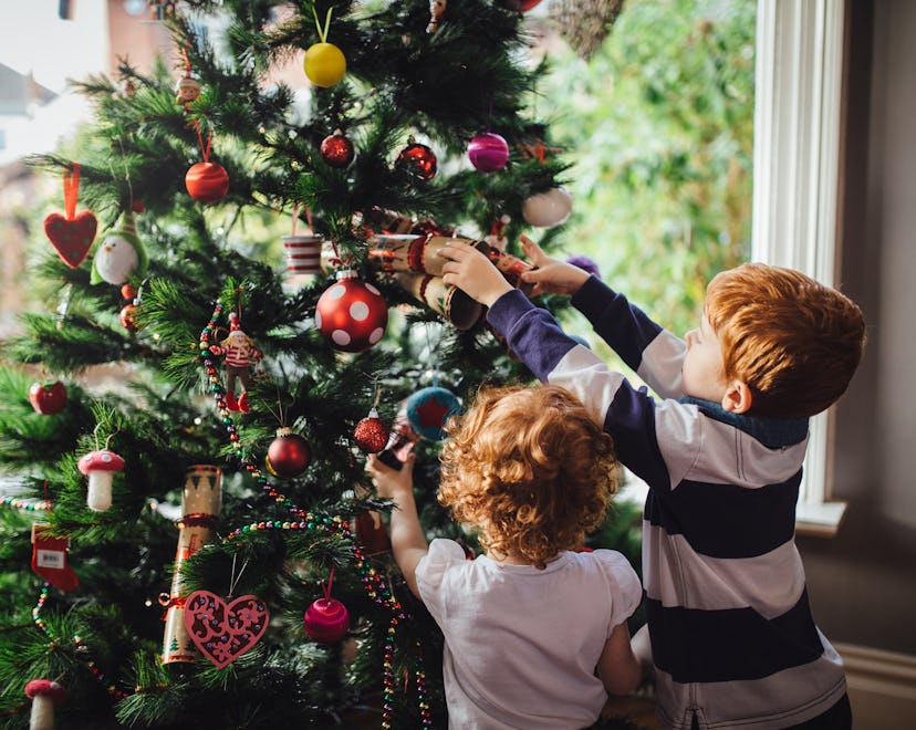 kids decorating a christmas tree should know what christmas is about. here's how to explain the holi...