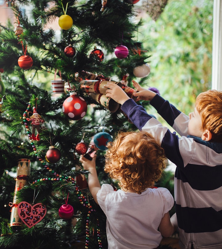 kids decorating a christmas tree should know what christmas is about. here's how to explain the holi...